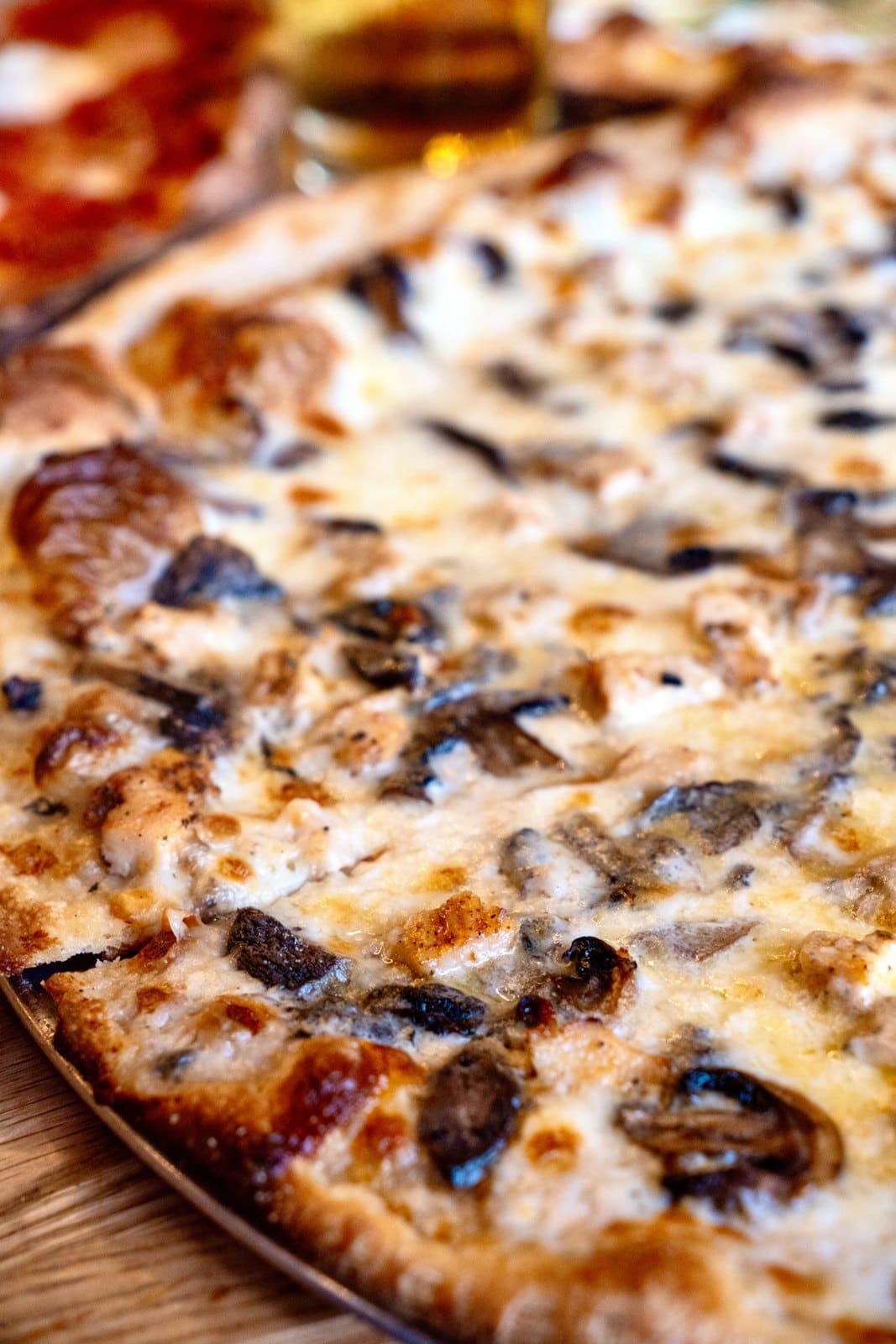 A white pie with mushrooms, up close