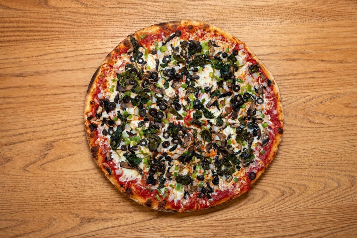 A whole veggie pie, overhead